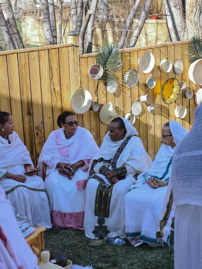 A group of women sitting together, chatting