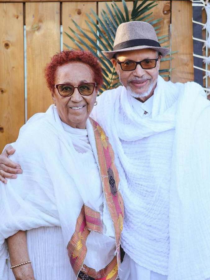 An elder couple smiling together
