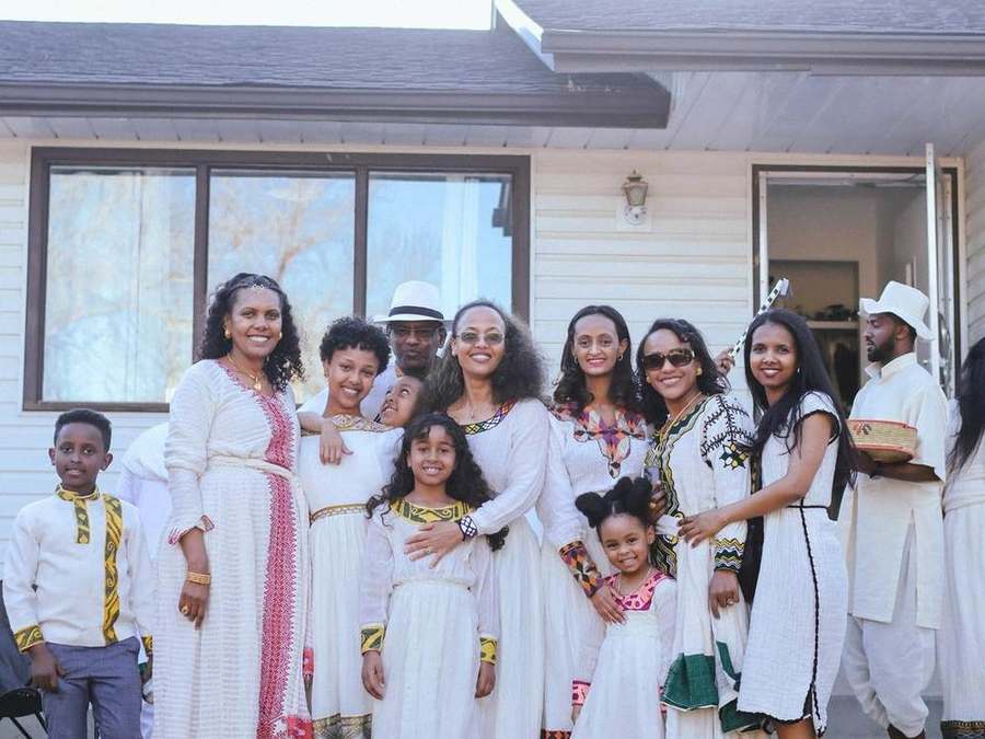 A large group of family and friends posing together