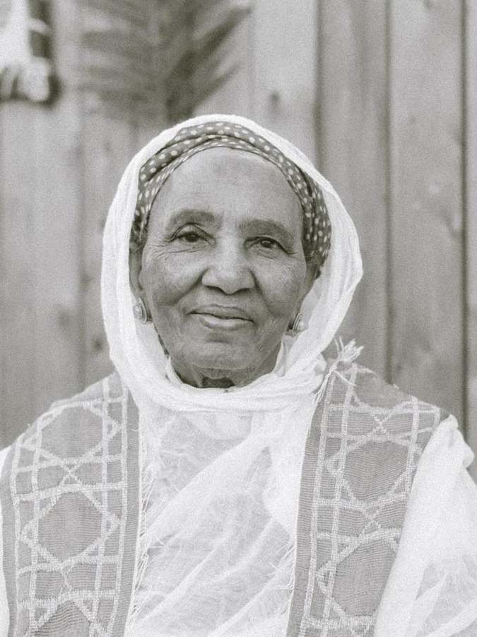 Portrait of an elder woman in a headscarf