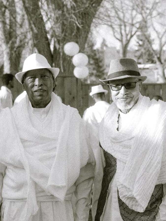 Two elder friends smiling together