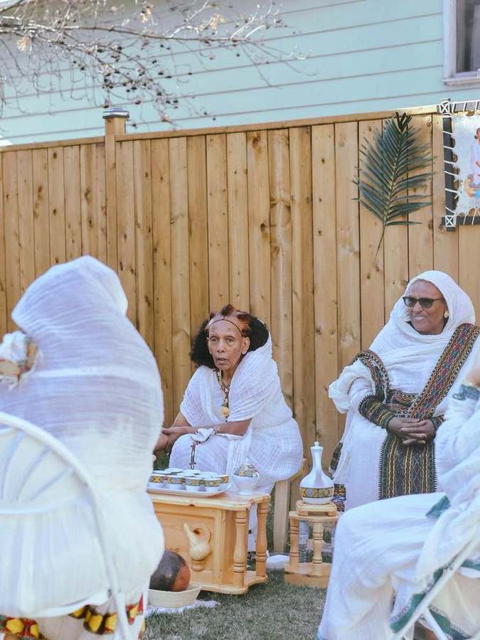 Guests gathered around the coffee ceremony table