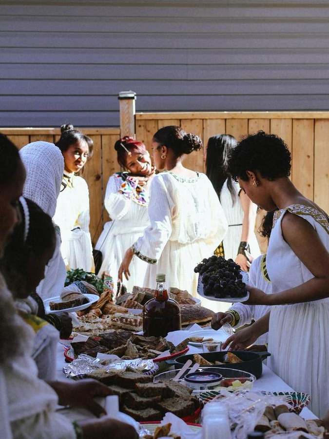 Guests gathered around the food table