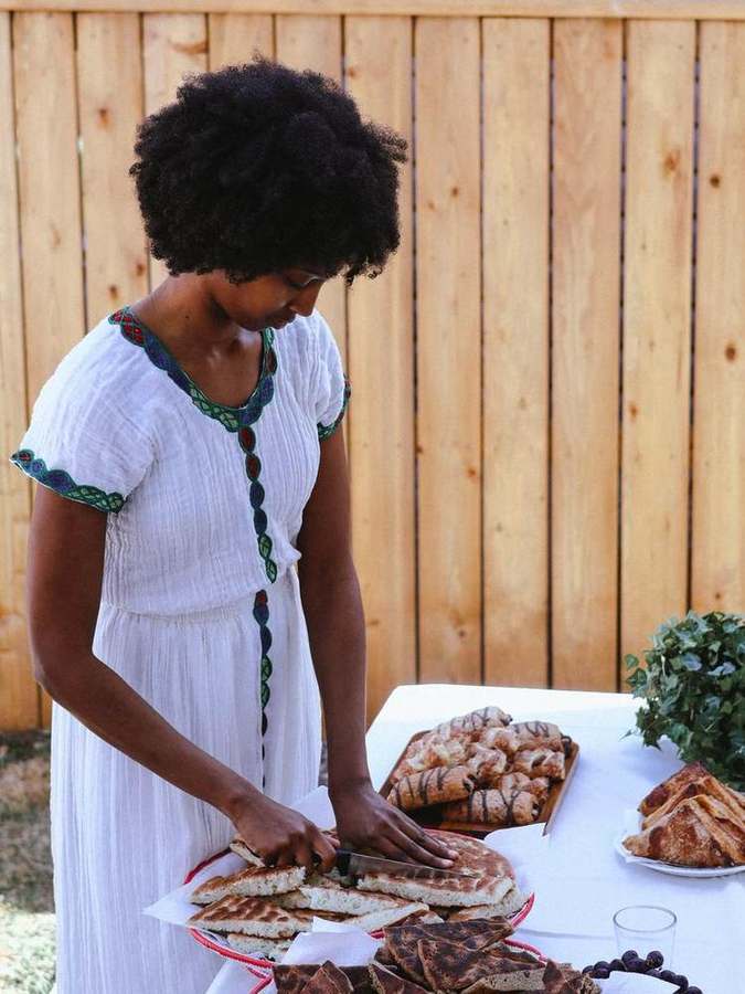 Woman slicing traditional bread