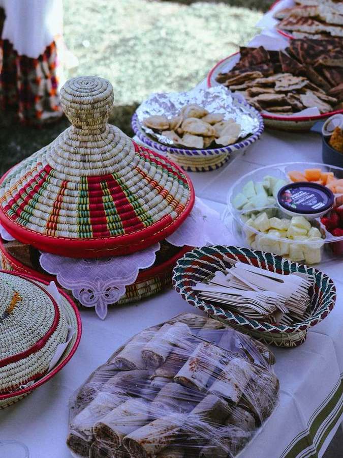 Injera rolls and utensils set out for serving